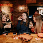 Girls having some drinks at the bar