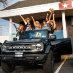 People posing outside of Daisy's Nashville Lounge