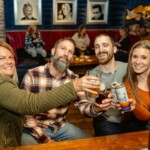 guests posing with beers