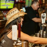 a bartender taking care of some guests