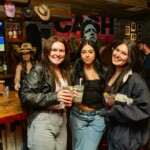 guests posing with a drink