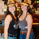 bartenders smiling at the camera posing for a picture