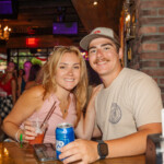 Two people with drinks at a table