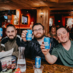3 Guys Enjoying Beers at the Bar